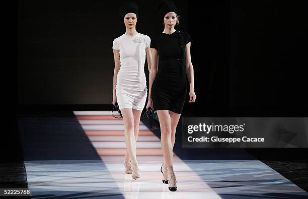 Models walk down the runway at the Emporio Armani fashion show as part of Milan Fashion Week Autumn/Winter 2005/06 at "Armani Theatre" on February...
