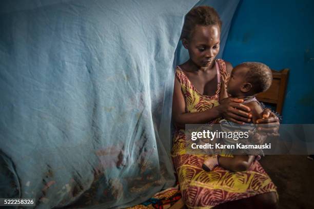 malaria check for ghana family - malaria parasite stock pictures, royalty-free photos & images