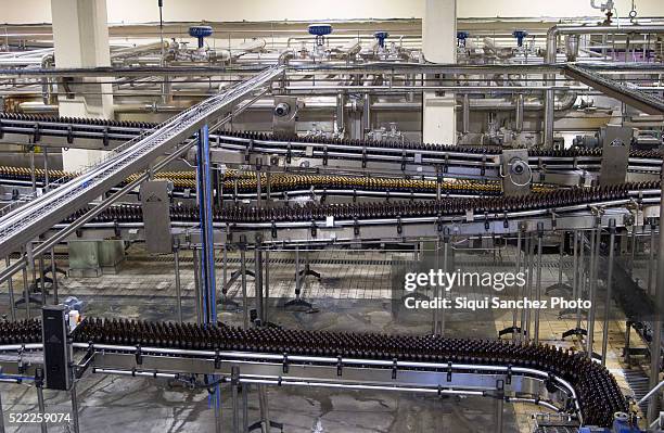 beer bottling plant. málaga, spain - bottling plant stock pictures, royalty-free photos & images