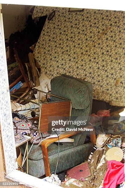 Mud and belongings are seen piled up inside a condominium after a 10-foot wall of mud smashed into it, filling the home to the ceiling and trapping...