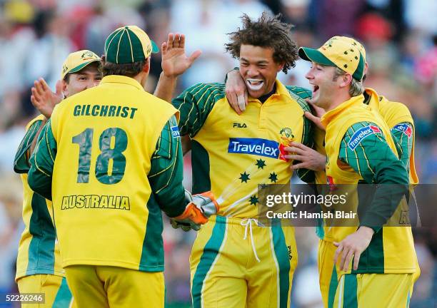 Andrew Symonds of Australia celebrates the wicket of Craig McMillan of New Zealand with team mates during the 2nd One Day International between New...