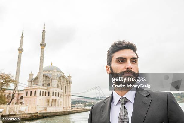 türkischer geschäftsmann porträt des bosporus in istanbul - menai straits stock-fotos und bilder