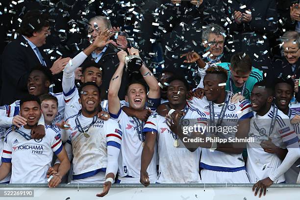 Charlie Colkett of Chelsea FC lifts the UEFA Youth League trophy in celebration after victoy in the UEFA Youth League Final match between Paris Saint...