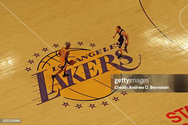 An overhead view of Kobe Bryant of the Los Angeles Lakers dribbling the ball up court against the Utah Jazz at STAPLES Center on April 13, 2016 in...