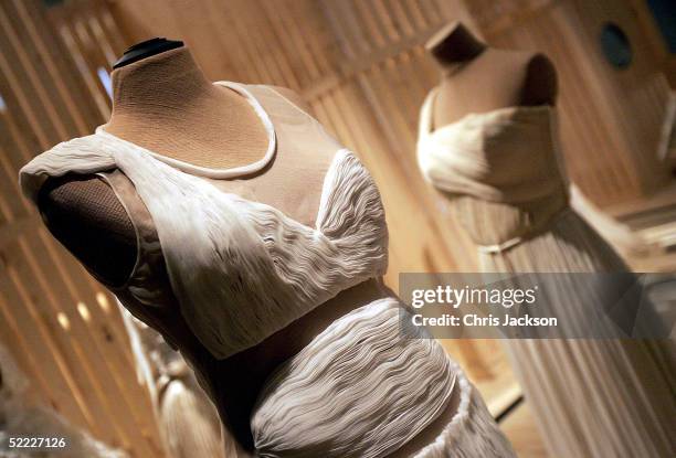 Contemporary dress by Helmut Lang is seen in front of a dress from 1968 by Madame Gres at the press view for "Spectres: When Fashion Turns Back", an...