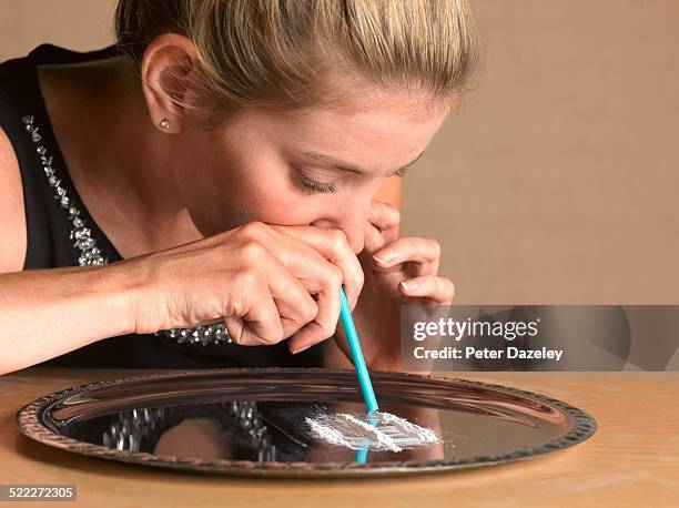 girl doing line of cocaine - cocaine stock pictures, royalty-free photos & images