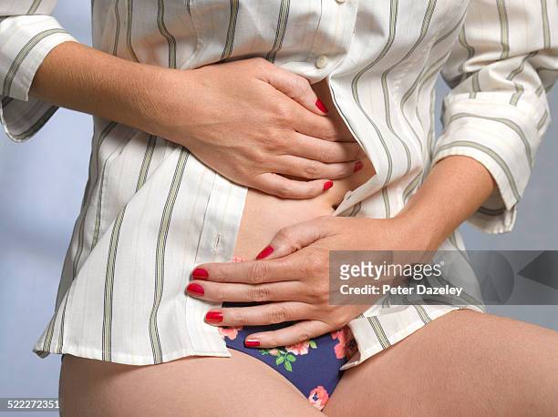 woman with irritable bowel syndrome - svullen bildbanksfoton och bilder