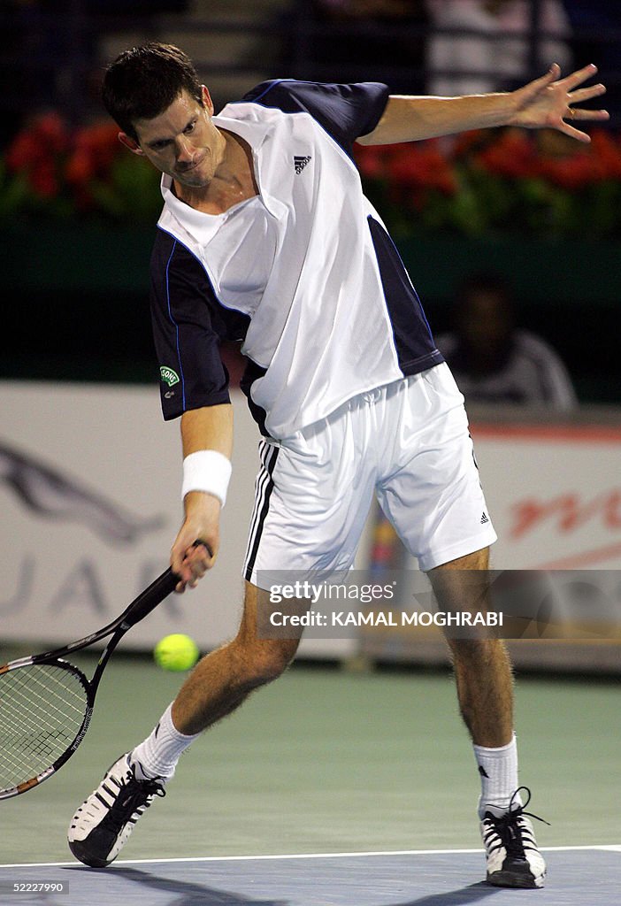 British Tim Hinman hits a forehand to hi