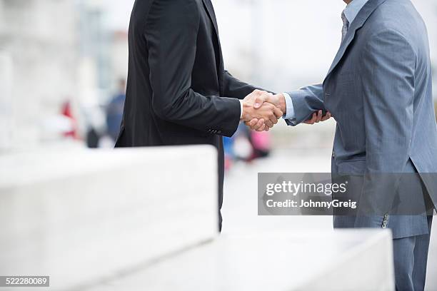 business handshake - business hand shake with arabs stock pictures, royalty-free photos & images