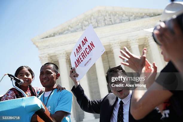 Six-year-old Sophie Cruz speaks during a rally in front of the U.S. Supreme Court next to her father Raul Cruz and supporter Jose Antonio Vargas...