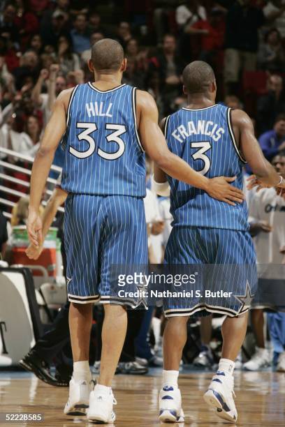 Steve Francis and Grant Hill of the Orlando Magic stand on the court during the game with the Cleveland Cavaliers at TD Waterhouse Centre on February...