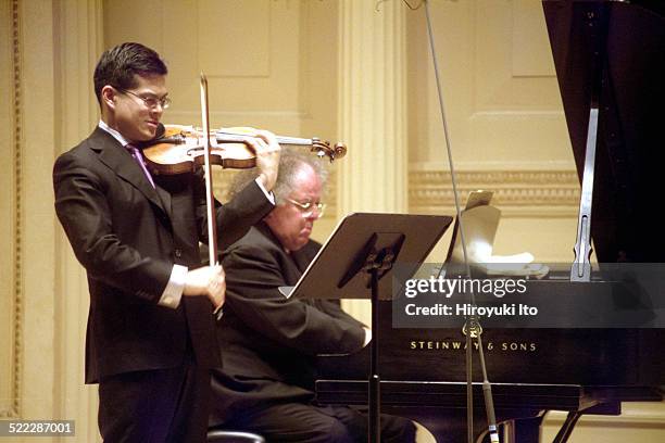 Met Chamber Ensemble performing at Weill Recital Hall on Sunday afternoon, March 7, 2004.This image:David Chan and James Levine performing Webern's...