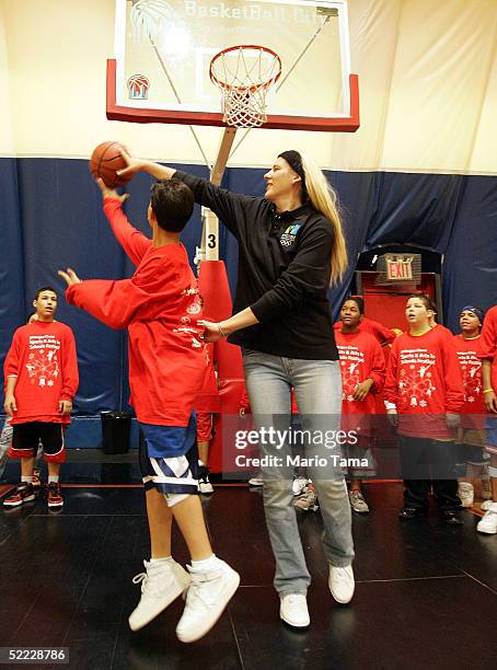 Lauren Jackson plays basketball with schoolchildren at the 2005 JPMorgan Chase Sports and Arts Festival February 22, 2005 in New York City. The free,...