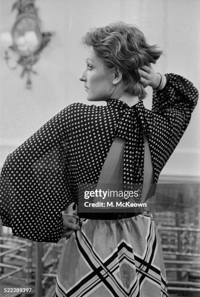 Model Kasia wearing a patterned skirt and backless polka dot blouse from the Hardy Amies Spring Collection, 18th January 1972.