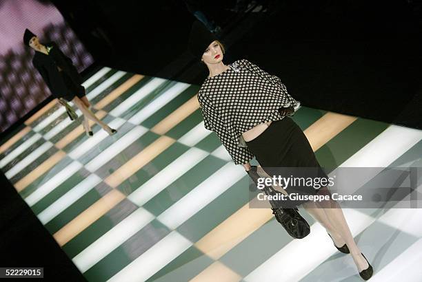 Models walk down the runway at the Giorgio Armani fashion show as part of Milan Fashion Week Autumn/Winter 2005/06 at Armani Theatre on February 22,...