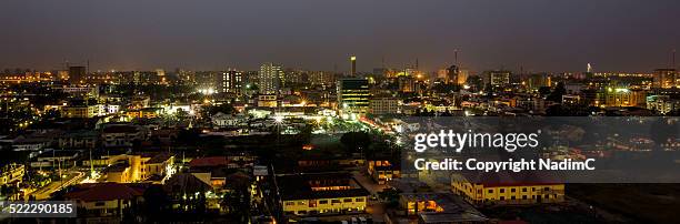 victoria island, lagos, at night - lagos nigeria stock-fotos und bilder