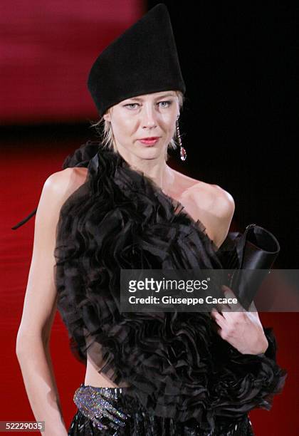 Model walks down the runway at the Giorgio Armani fashion show as part of Milan Fashion Week Autumn/Winter 2005/06 at Armani Theatre on February 22,...