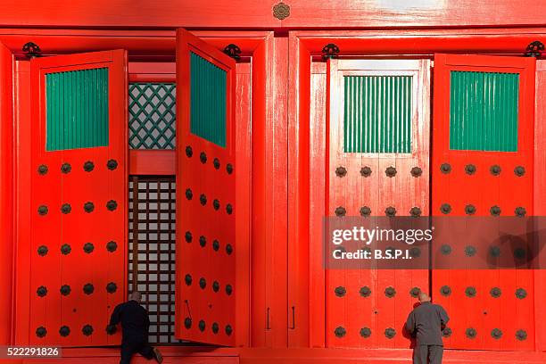 monks at konpon daito pagoda atop sacred koyasan mountain in wakayama, japan - konpon daito stock pictures, royalty-free photos & images