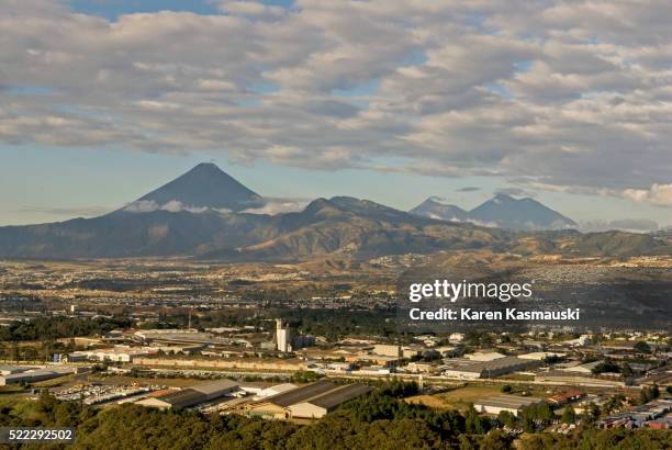 volcanoes and guatemala city - guatemala city skyline stock pictures, royalty-free photos & images