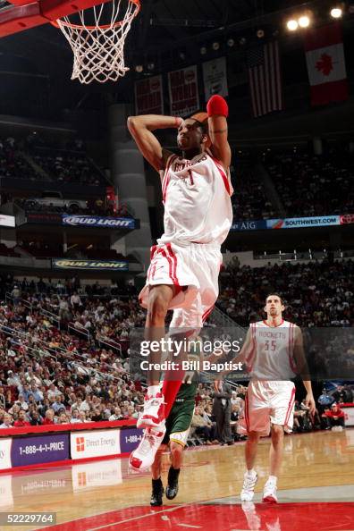 T Mac Rockets Tracy McGrady of the Houston Rockets goes in for the dunk in front of ...