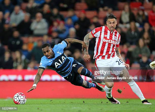 Danny Rose of Tottenham Hotspur and Geoff Cameron of Stoke City during the Barclays Premier League match between Stoke City and Tottenham Hotspur at...