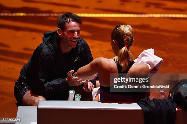 Sabine Lisicki of Germany is instructed by her coach Christopher Kas during her match against Timea Babos of Hungary during Day 1 of the Porsche...