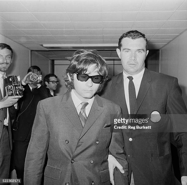 Polish film director and writer Roman Polanski at London Airport on his way to Los Angeles where his wife, Sharon Tate, has been murdered, London,...