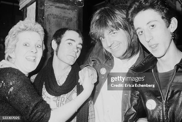 Punk fan Suzi with publicist BP Fallon, musician and producer Nick Lowe and Andy Blade of Eater, Hope and Anchor, London, November 1976.