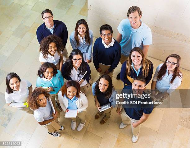 view from above of diverse private high school students - crowd looking up stock pictures, royalty-free photos & images