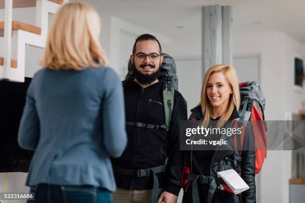 young couple renting apartment - backpacker apartment stock pictures, royalty-free photos & images