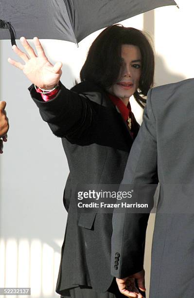 Singer Michael Jackson waves as he arrives at Santa Barbara County Courthouse for continuation in the jury selection phase of his child molestation...