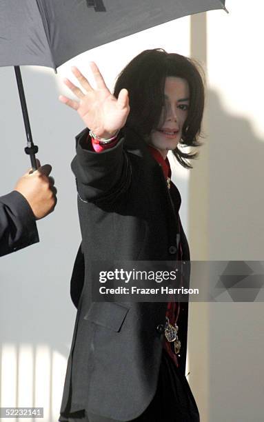 Singer Michael Jackson waves as he arrives at Santa Barbara County Courthouse for continuation in the jury selection phase of his child molestation...