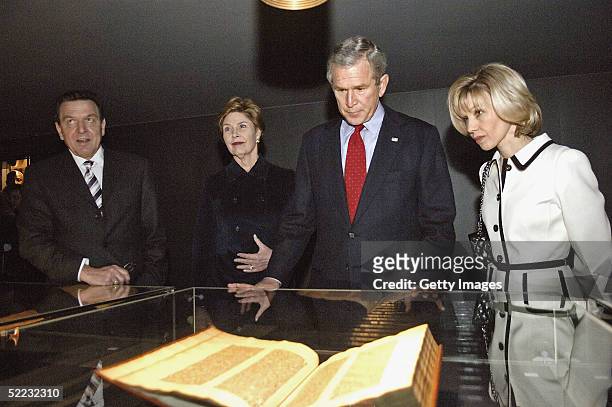 German Chancellor Gerhard Schroeder, Laura Bush, U.S President George .W. Bush and Doris Schroeder-Kopf look at the Gutenberg Bible in the Gutenberg...