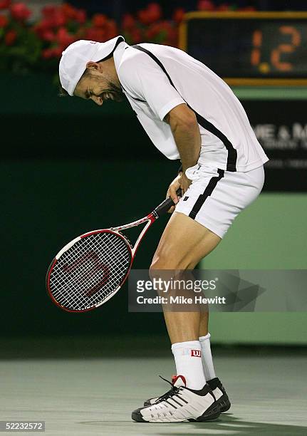 Nicolas Kiefer of Germany winces during his victory over Hyung-Taik Lee in their second round match in the Dubai Duty Free Men's Open Tennis...