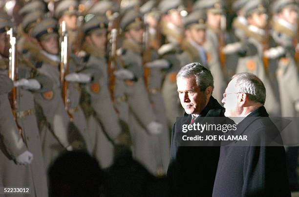 President George W. Bush and his Slovak counterpart Ivan Gasparovic examine guard of honour at MR Stefanik's airport in Bratislava 23 February 2005,...
