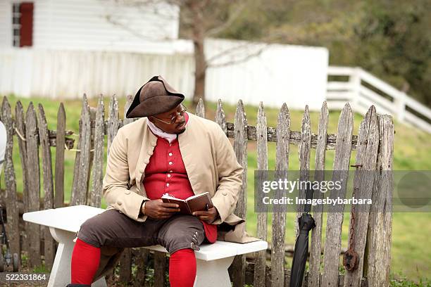 colonist reading - williamsburg stock pictures, royalty-free photos & images