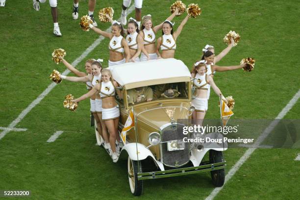 Georgia Tech Cheerleaders ride the Rambling Wreck - a 1930 Ford Cabriolet Sport Coupe - during an intermission in the game between the Georgia Tech...