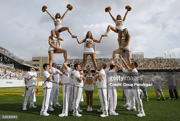 Georgia Tech Cheerleaders make a pyramid during the game between the Georgia Tech Yellow Jackets and the University of Virginia Cavaliers at Bobby...