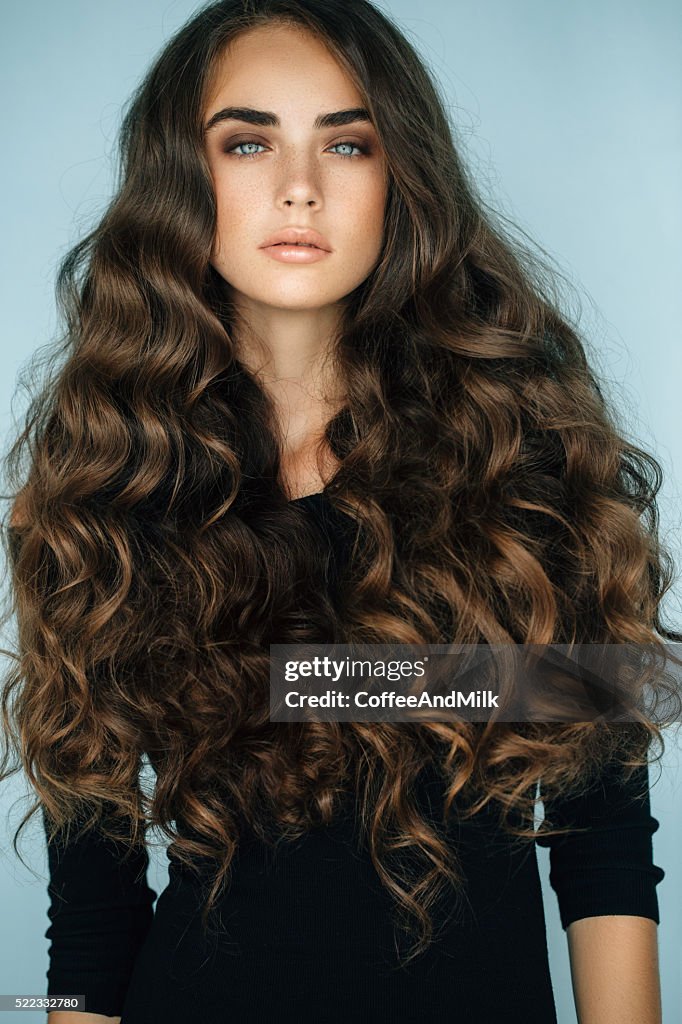 Studio shot of young beautiful woman