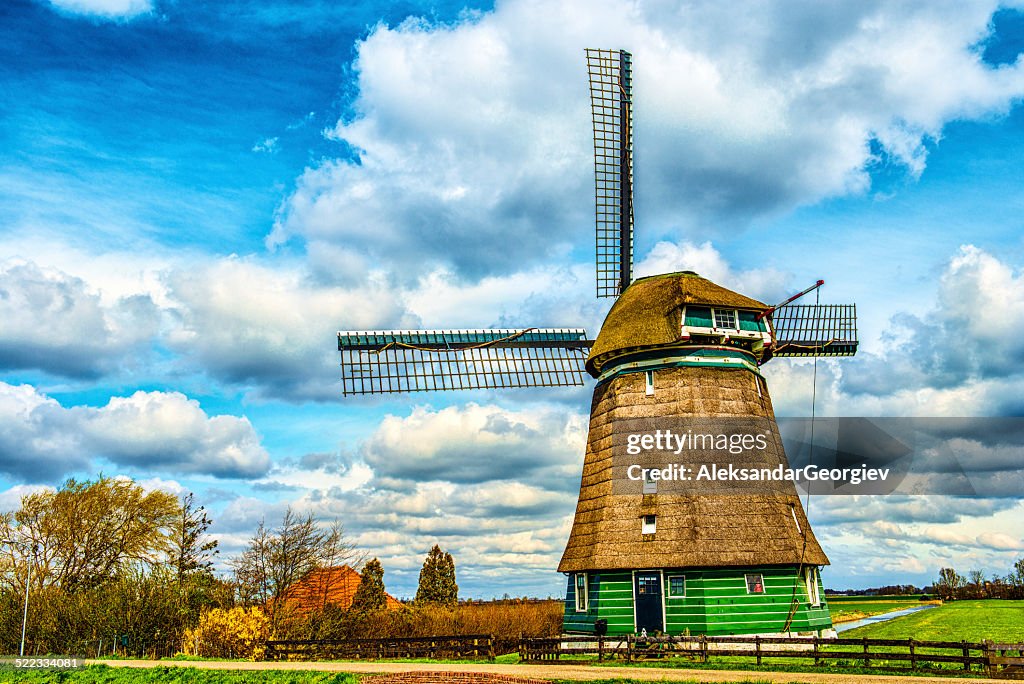 Traditional Dutch Windmill on a Typical Canal in Netherlands