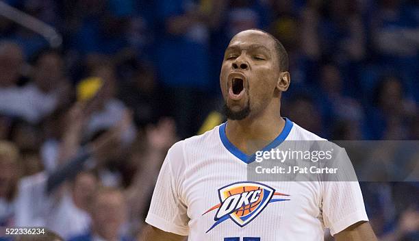 Kevin Durant of the Oklahoma City Thunder reacts after scoring against the Dallas Mavericks during the second half of Game One of the Western...