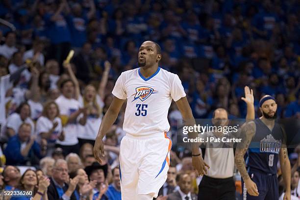 Kevin Durant of the Oklahoma City Thunder watches a replay against the Dallas Mavericks during the second half of Game One of the Western Conference...