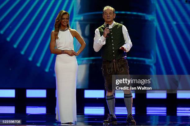 Hosts Kate Abdo and Bill Murray on stage dressed in Lederhosen during the 2016 Laureus World Sports Awards at the Messe Berlin on April 18, 2016 in...