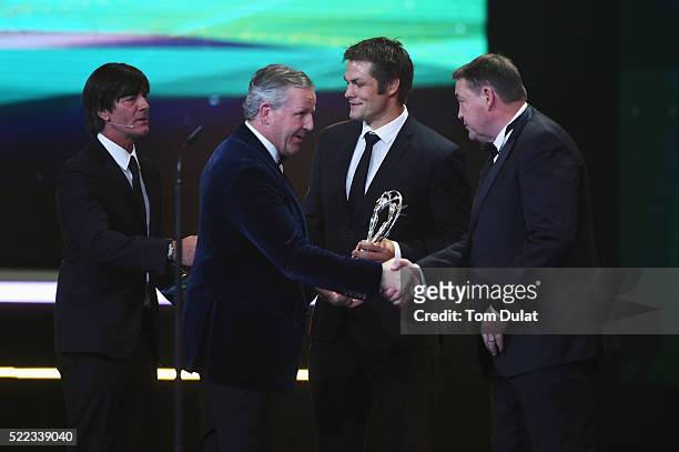 Steve Hansen, coach of the All Blacks accepts with All Blacks Captain Richie McCaw on behalf of the All Blacks rugby from Laureus World Sports...