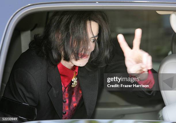 Musician Michael Jackson gestures as he departs the Santa Barbara County Courthouse during the jury selection phase of his child molestation trial...