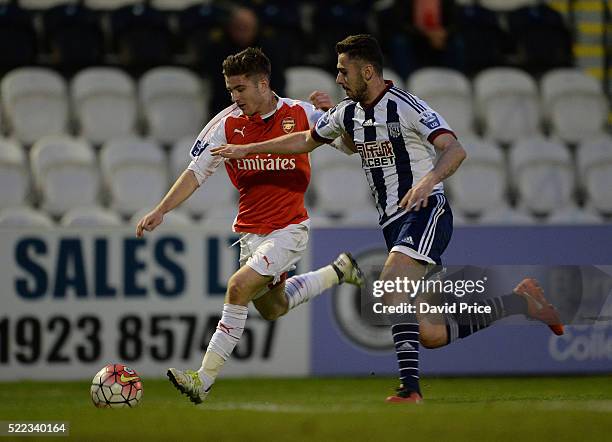 Dan Crowley of Arsenal takes on Robbie McCourt of WBA during the match between Arsenal U21 and West bromwich Albion U21 at Meadow Park on April 18,...