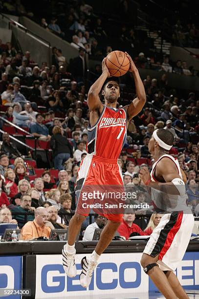 Jason Hart of the Charlotte Bobcats shoots over Sebastian Telfair of the Portland Trail Blazers during the game on February 4, 2005 at the Rose...