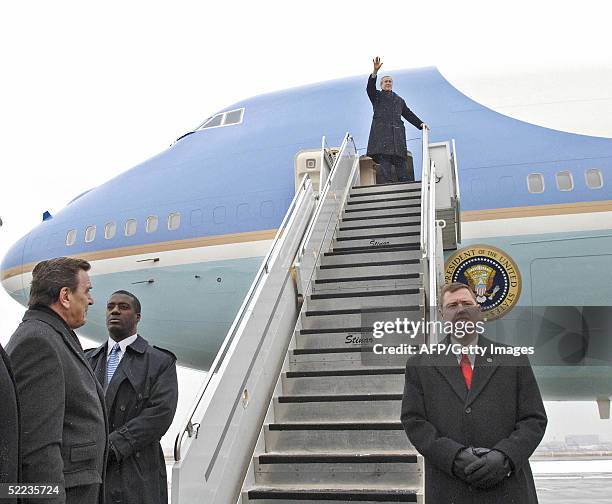 Germany: German Chancellor Gerhard Schroeder waits as US President George W. Bush waves as he steps out of Air Force one, upon his arrival at...