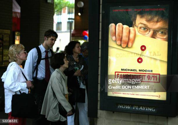 Movie goers line up to see director Michael Moore's documentary "Fahrenheit 9/11" at a theater in New York 25 June, 2004. Two of the most...