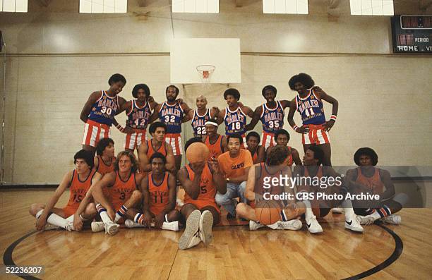 Publicity still from the CBS drama series 'The White Shadow' shows special guests the Harlem Globetrotters basketball team as they stand behind the...